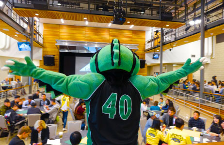 alligator mascot in front of students
