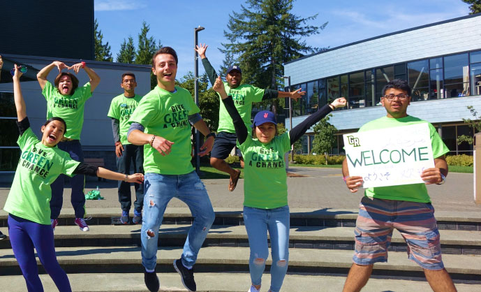 excited students jumping and smiling